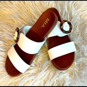 Mia white slide on sandals with brown buckle